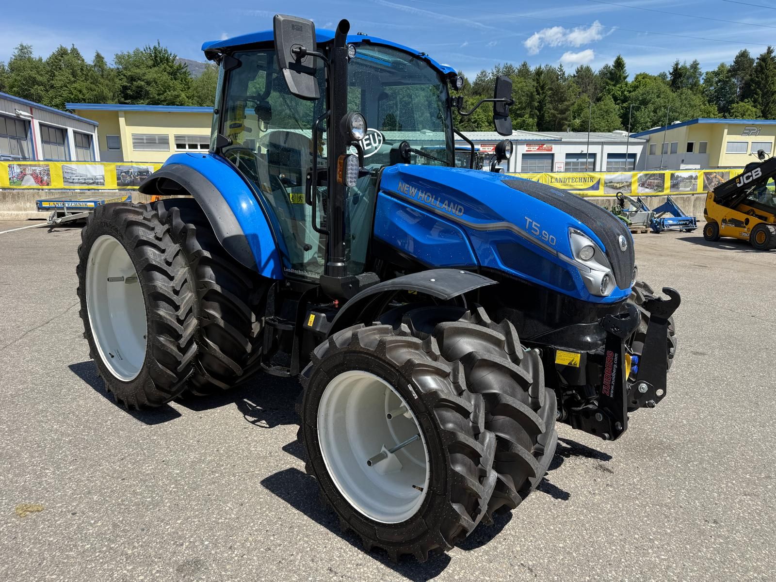 Seitenansicht - New Holland T5.90 Utility Dual Command Seitenansicht - New Holland T5.90 Utility Dual Command